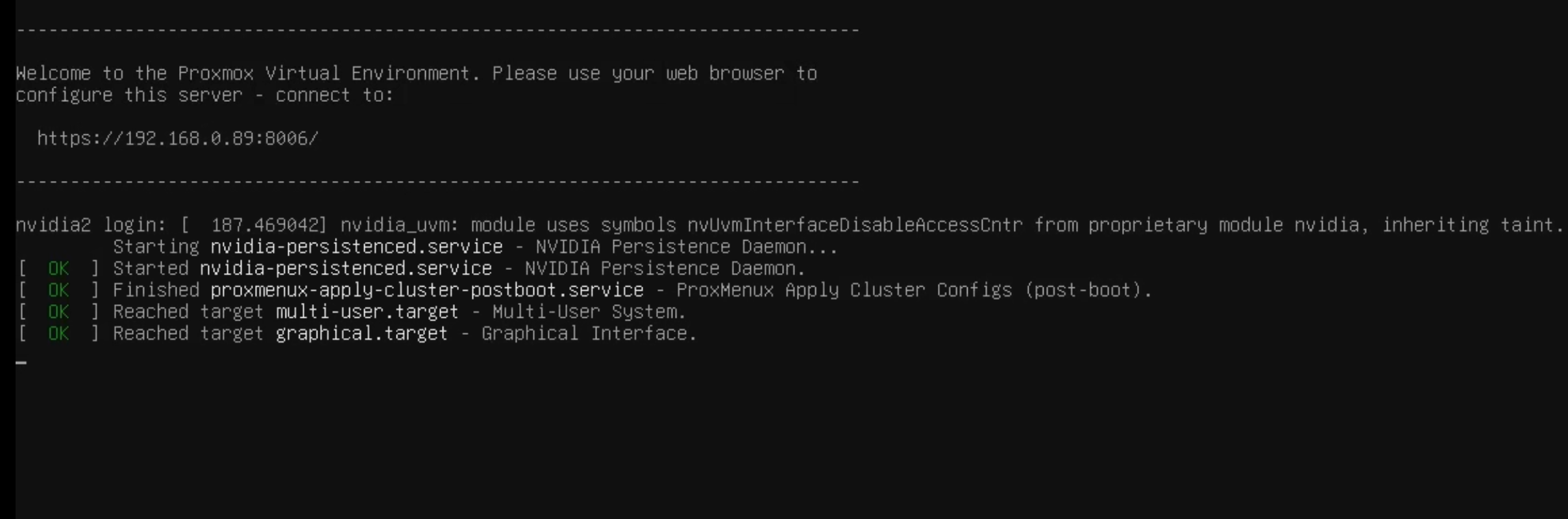 Proxmox physical console showing '[ OK ] Finished proxmenux-apply-cluster-postboot.service - ProxMenux Apply Cluster Configs (post-boot).' followed by the OK for multi-user.target and graphical.target, with the host login prompt above.